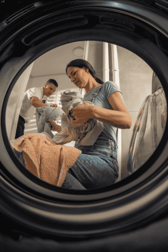 Couple doing laundry together.