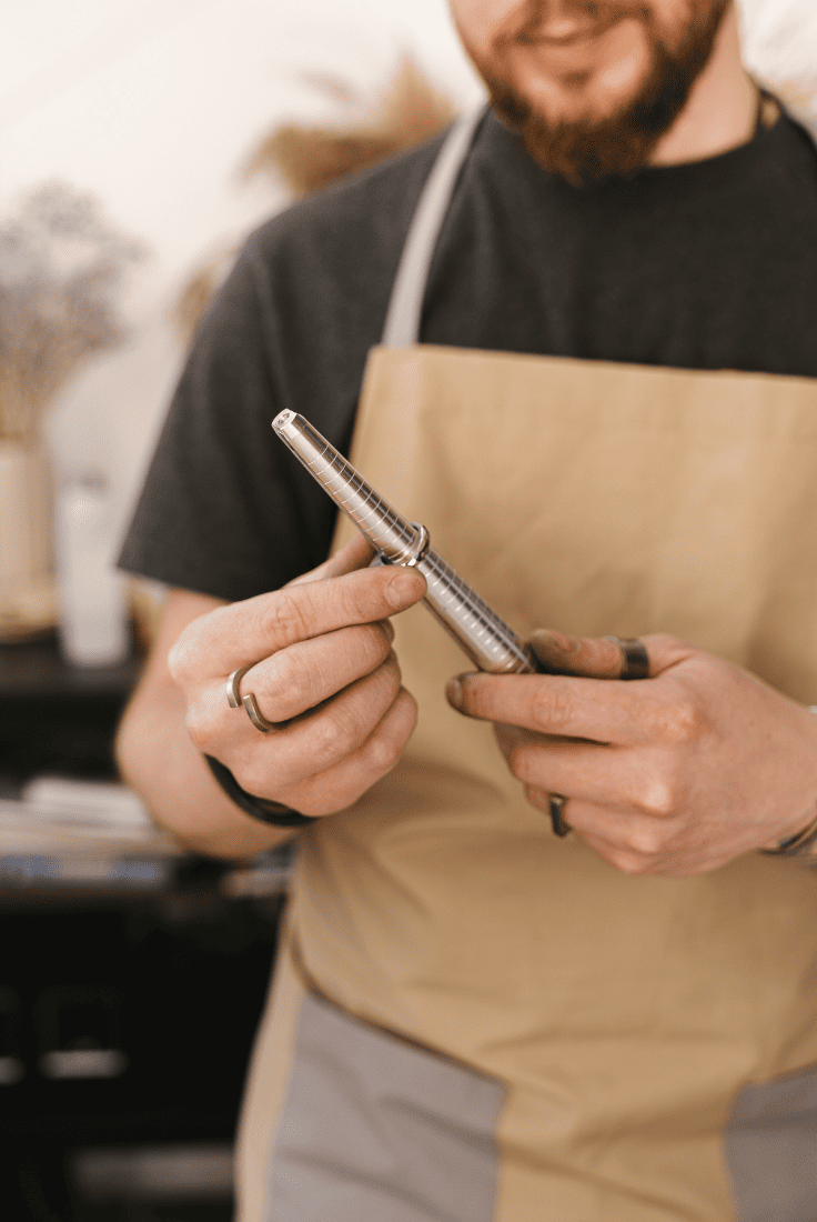 A Professional Jeweler checking the size of a ring.