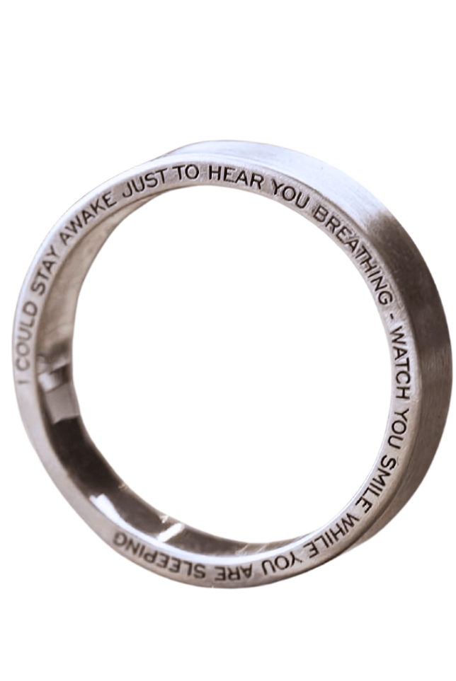 A short phrase from a song, custom engraved ring.