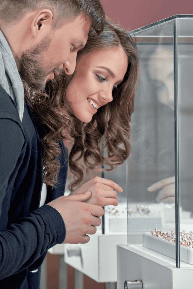 Couple's looking for their wedding rings in Jewelry Store