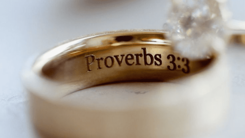 Engraved Wedding Ring Says, "Proverbs 3:3"